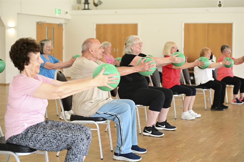 Members taking part in a strength exercise