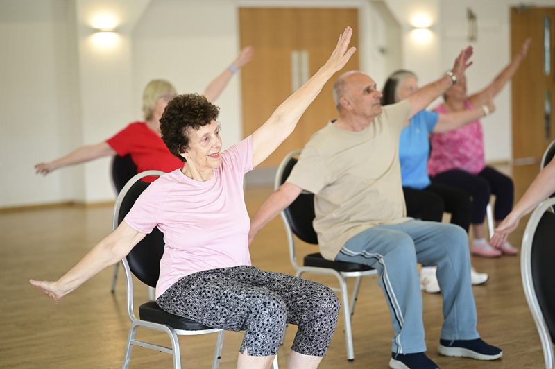 Members stretching during a class
