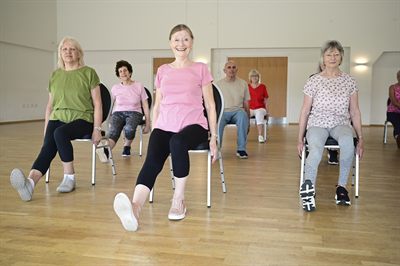 Members stretching together during a class